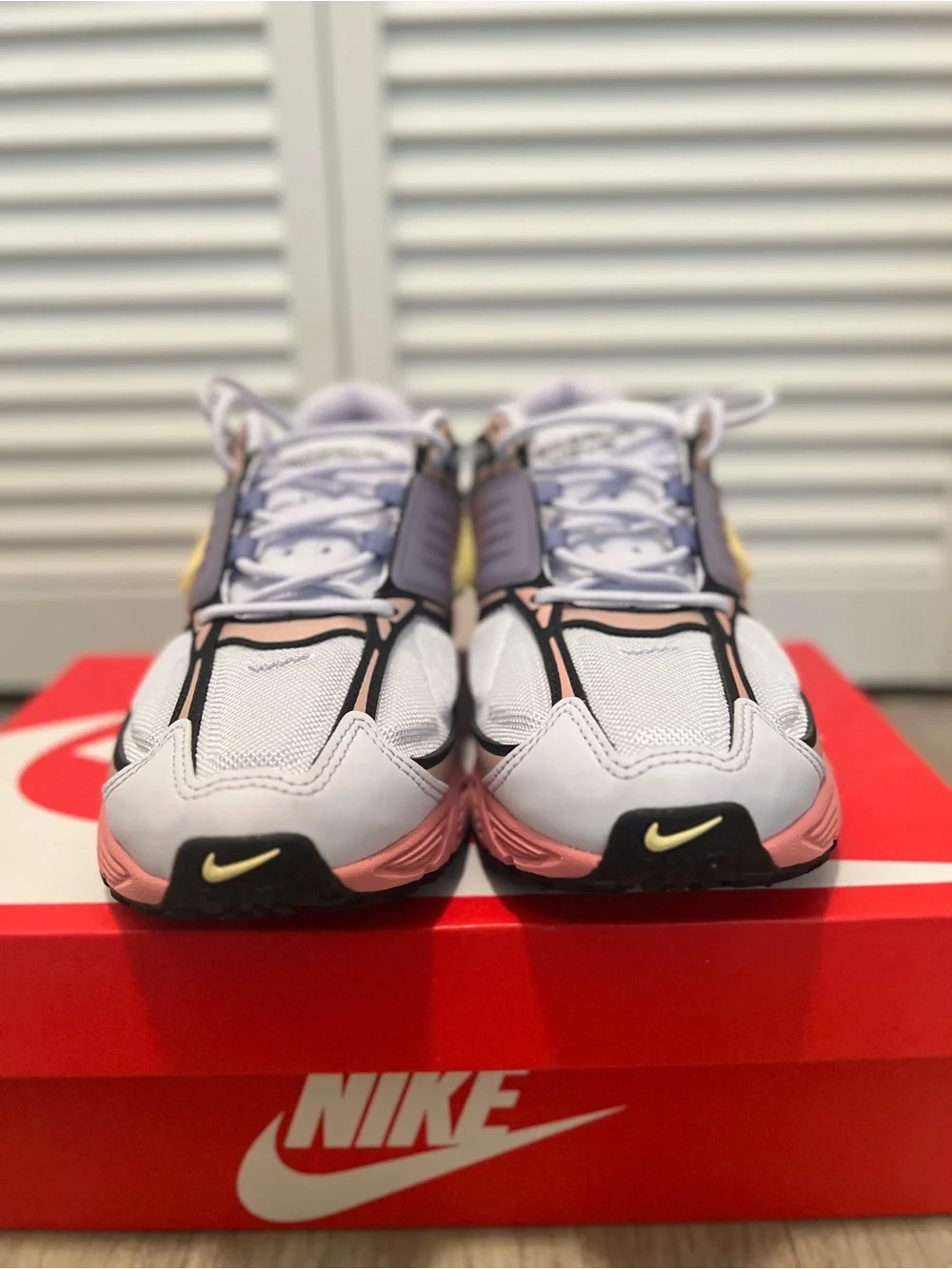 Nike men’s Pink and Gray Sneakers with Yellow Swoosh